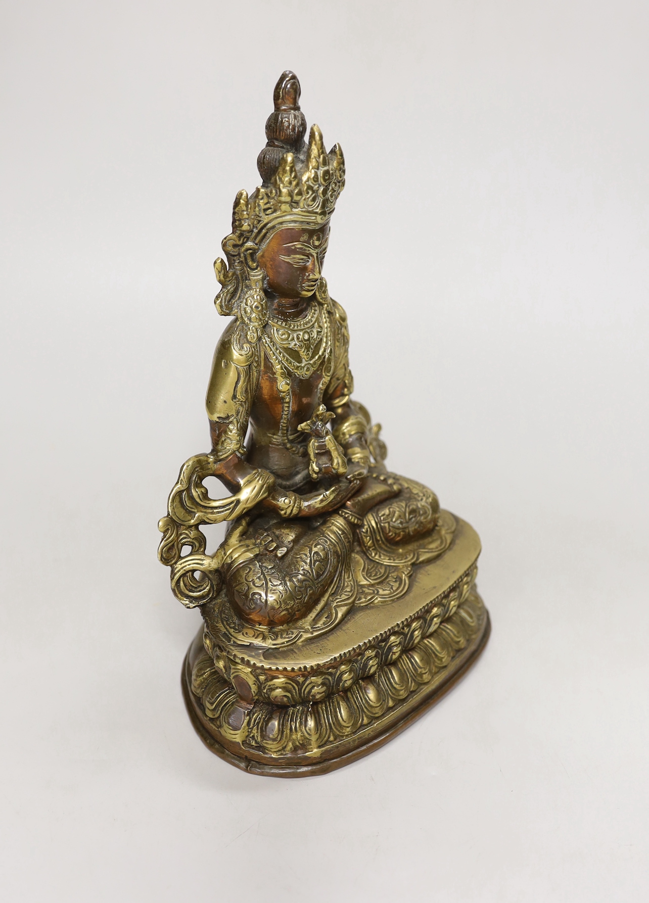 A Buddhist gilt copper alloy figure of a Bodhisattva, 22cm high